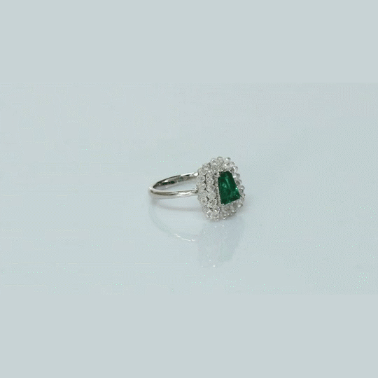 A fine emerald centerpiece surrounded by sparkling diamonds, creating a timeless ring filled with elegance, beauty, and charm.(PGDR0511)