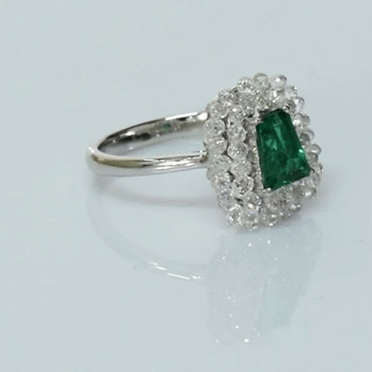 A fine emerald centerpiece surrounded by sparkling diamonds, creating a timeless ring filled with elegance, beauty, and charm.(PGDR0511)