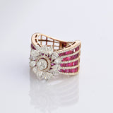 A radiant bloom of brilliant diamonds set against layers of rich rubies—crafted to make every moment shine. (PGDR0515)
