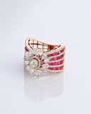 A radiant bloom of brilliant diamonds set against layers of rich rubies—crafted to make every moment shine. (PGDR0515)
