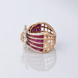 A radiant bloom of brilliant diamonds set against layers of rich rubies—crafted to make every moment shine. (PGDR0515)