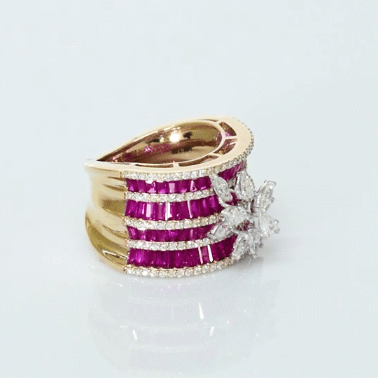Layers of radiant rubies framed with shimmering diamonds, crowned by a floral diamond motif—pure elegance in every detail. (PGDR0517)