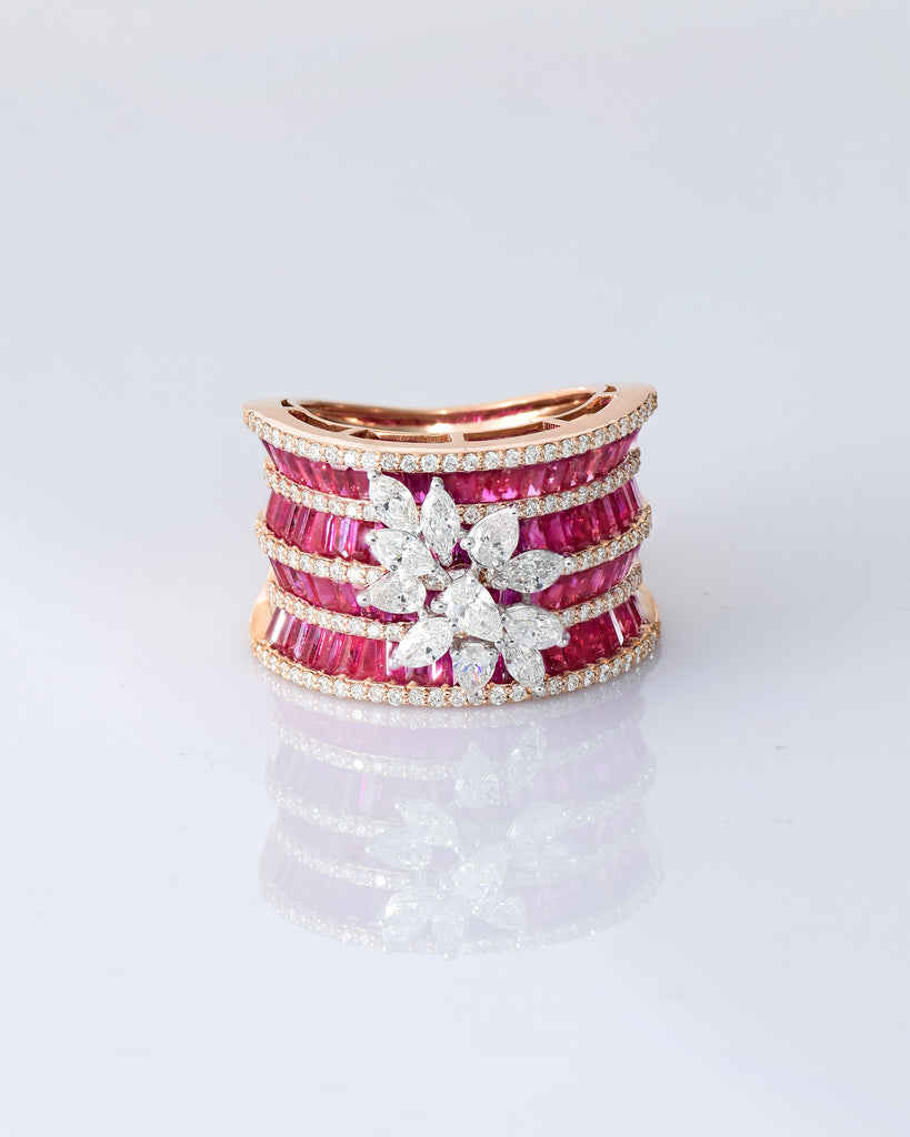 Layers of radiant rubies framed with shimmering diamonds, crowned by a floral diamond motif—pure elegance in every detail. (PGDR0517)