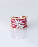 Layers of radiant rubies framed with shimmering diamonds, crowned by a floral diamond motif—pure elegance in every detail. (PGDR0517)
