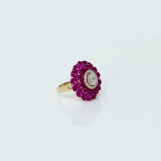 A radiant floral ring featuring vibrant rubies and sparkling diamonds, designed to capture attention with timeless elegance.(PGDR0519)