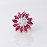 Ruby petals and sparkling diamonds bloom together in this floral ring, creating a vibrant and elegant statement piece.(PGDR0521)