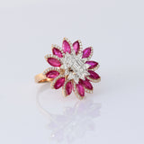 Ruby petals and sparkling diamonds bloom together in this floral ring, creating a vibrant and elegant statement piece.(PGDR0521)