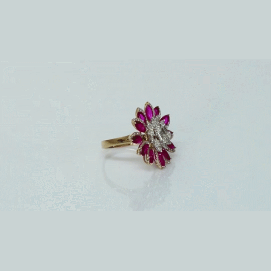 Ruby petals and sparkling diamonds bloom together in this floral ring, creating a vibrant and elegant statement piece.(PGDR0521)
