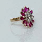 Ruby petals and sparkling diamonds bloom together in this floral ring, creating a vibrant and elegant statement piece.(PGDR0521)
