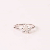 A breathtaking pear-shaped diamond embraced by shimmering side stones, creating a ring of effortless elegance.(PGDR0536)
