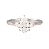 A breathtaking pear-shaped diamond embraced by shimmering side stones, creating a ring of effortless elegance.(PGDR0536)