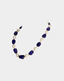 A single-line necklace with South Sea pearls and long tanzanite maniya, strung on gold wire for a simple, elegant, and timeless look.(STRG360)