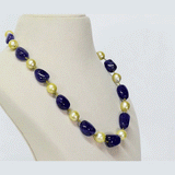A single-line necklace with South Sea pearls and long tanzanite maniya, strung on gold wire for a simple, elegant, and timeless look.(STRG360)