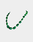 A single-line string of vibrant emerald maniya delicately strung on gold wire, showcasing timeless elegance.(STRG364)