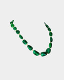 A single-line string of vibrant emerald maniya delicately strung on gold wire, showcasing timeless elegance.(STRG364)