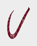 A luxurious three-layer necklace of premium Burmese ruby beads accented with diamond rondelles, showcasing rich colour, exceptional quality, and timeless elegance for a refined statement look. (STRG390)
