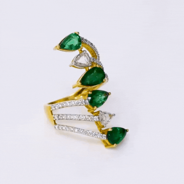 Stunning Ring adorned with a mesmerizing array of diamond rounds, rose-cut diamonds, and pear-shaped emeralds, a true embodiment of luxury and elegance.((PGDR0414)