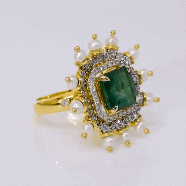 Ring featuring a breathtaking Emerald Cut Octagon Emerald, adorned with shimmering diamonds and lustrous pearls, creating a captivating masterpiece that radiates elegance(PGDR0441)