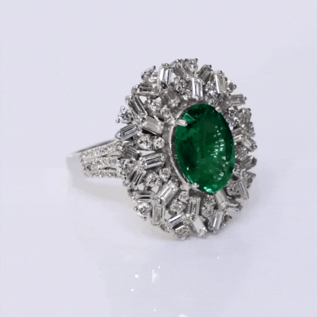 Emerald and Diamond Ring, featuring captivating oval emeralds and sparkling diamond baguettes and round. Each exquisite detail is meticulously crafted to exude elegance and charm, making it the perfect statement piece for any occasion.(PGDR0365)
