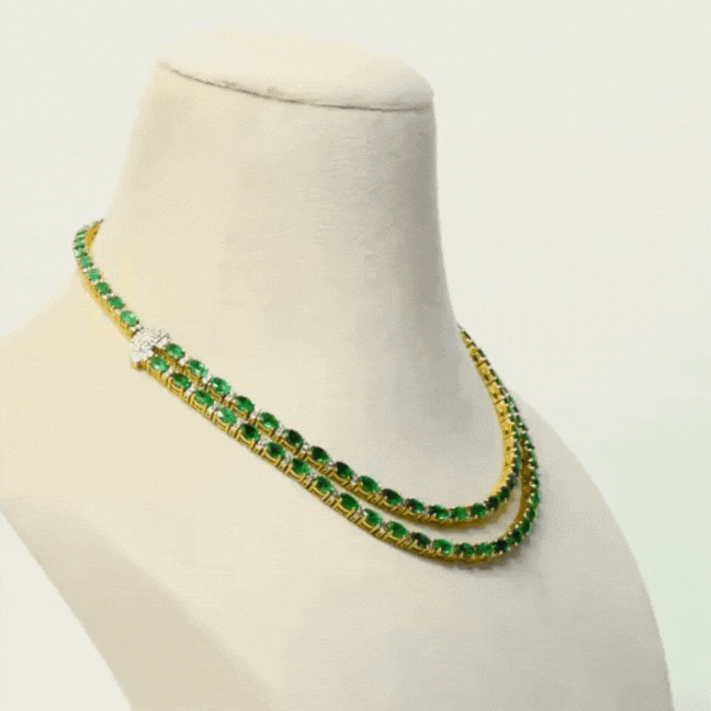 Our double line necklace set features mesmerizing Emerald ovals and dazzling round diamonds, perfectly curated to captivate hearts.(GDNE0488)