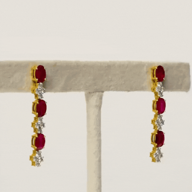 Elegance meets allure with our single line ruby and diamond necklace and earring pair. Crafted to perfection, each piece exudes timeless sophistication and luxury.