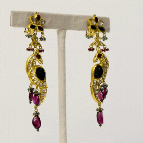 Peacock-inspired stunning long earring pair. Adorned with shimmering diamond polki and vibrant colored stones,(KME2090)