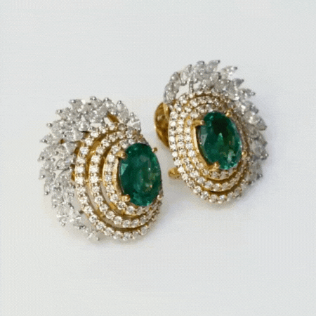 Earring pair with Radiant emeralds and diamonds intertwine in mesmerizing round and marquise cuts, set in a captivating dance of white and yellow gold.(PGDE0144)