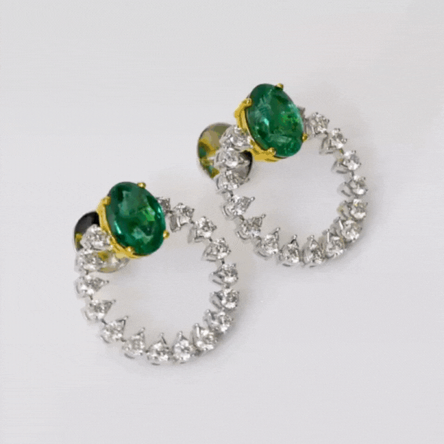 Tops pair featuring mesmerizing emerald-cut ovals adorned with sparkling diamonds.(PGDE0342)
