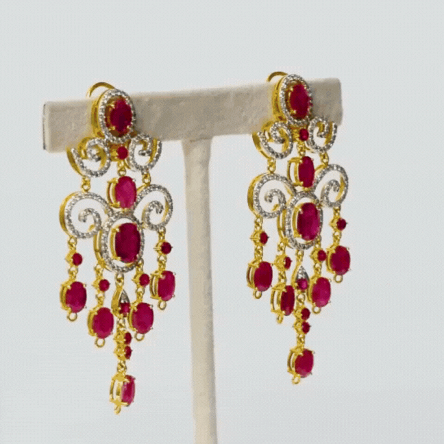 Long earring pair, adorned with lustrous round and oval rubies embraced by shimmering diamonds. Elevate every occasion with elegance and sophistication.(GDE0436)