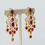 Long earring pair, adorned with lustrous round and oval rubies embraced by shimmering diamonds. Elevate every occasion with elegance and sophistication.(GDE0436)
