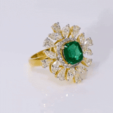 Introducing our exquisite Ring, a masterpiece of unparalleled beauty and sophistication, adorned with a fine quality Emerald and an array of multi-shaped Diamonds.(PGDR0434)