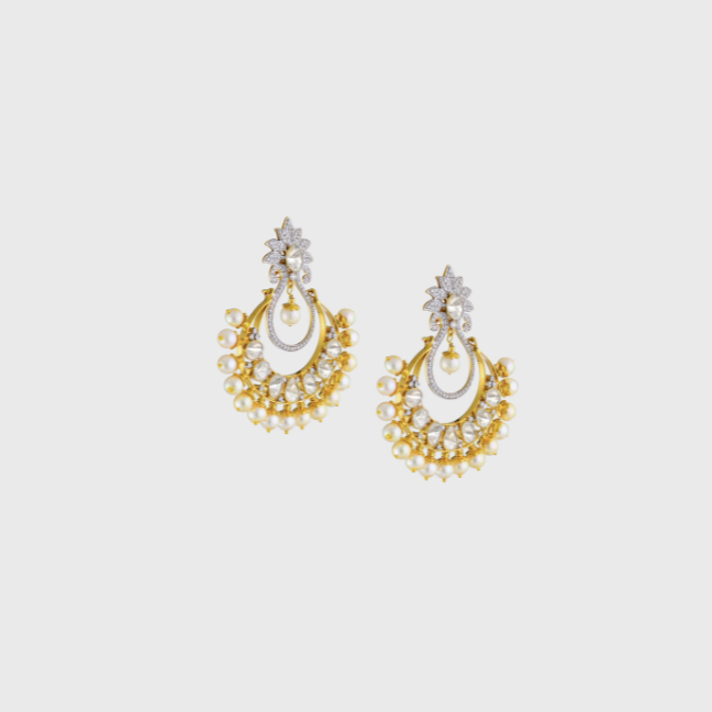 Dazzle with sophistication in our Chandbali-style earrings, featuring mesmerizing diamond polki, radiant diamond rounds, and delicate pearls.(WDN1121)