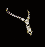 Elegant fusion-style necklace and earring pair featuring uncut diamond Polki, sparkling round diamonds, and subtle red enamel accents—perfectly blending traditional charm with modern sophistication for a standout look.(WDN1214)