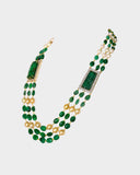 A luxurious necklace with double side pieces showcasing large carved emeralds accented by round diamonds, strung with emerald beads and South Sea pearls for timeless elegance.(WDN1239)