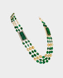 A luxurious necklace with double side pieces showcasing large carved emeralds accented by round diamonds, strung with emerald beads and South Sea pearls for timeless elegance.(WDN1239)