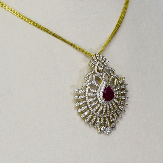 A stunning pendant with a vibrant pear ruby and round diamonds, offering classic elegance and luxurious, eye-catching charm.(WDN749)