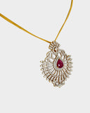 A stunning pendant with a vibrant pear ruby and round diamonds, offering classic elegance and luxurious, eye-catching charm.(WDN749)