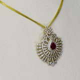 A stunning pendant with a vibrant pear ruby and round diamonds, offering classic elegance and luxurious, eye-catching charm.(WDN749)