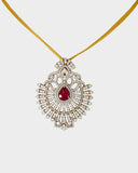A stunning pendant with a vibrant pear ruby and round diamonds, offering classic elegance and luxurious, eye-catching charm.(WDN749)