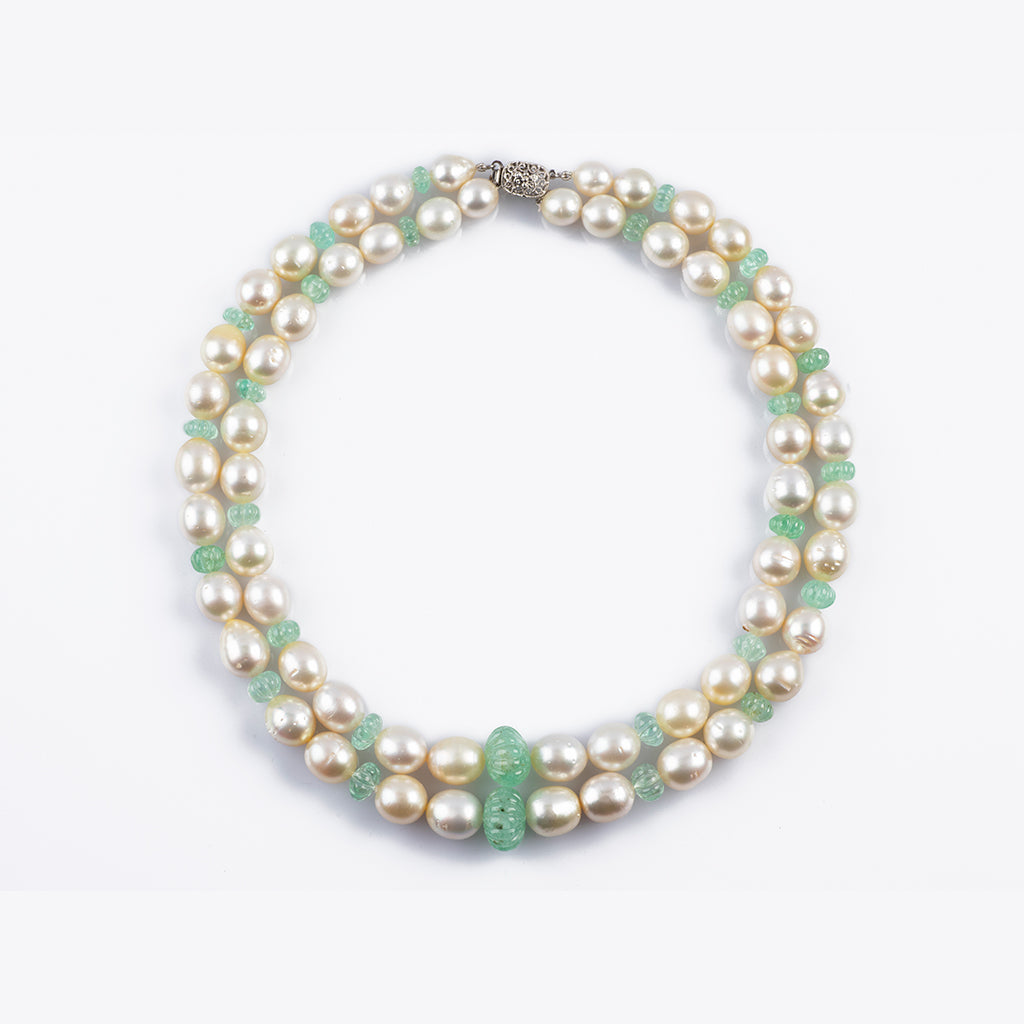 Two line necklace with emerald carved beads and south sea pearls with gold clasp STRG263
