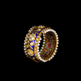 Blue meena broad kada in 22k gold with uncut diamond The broad size of the kada ensures that it fits comfortably on most wrist sizes and the sturdy construction makes it a durable piece of jewelry that can be treasured for years to come.  - KMB0485