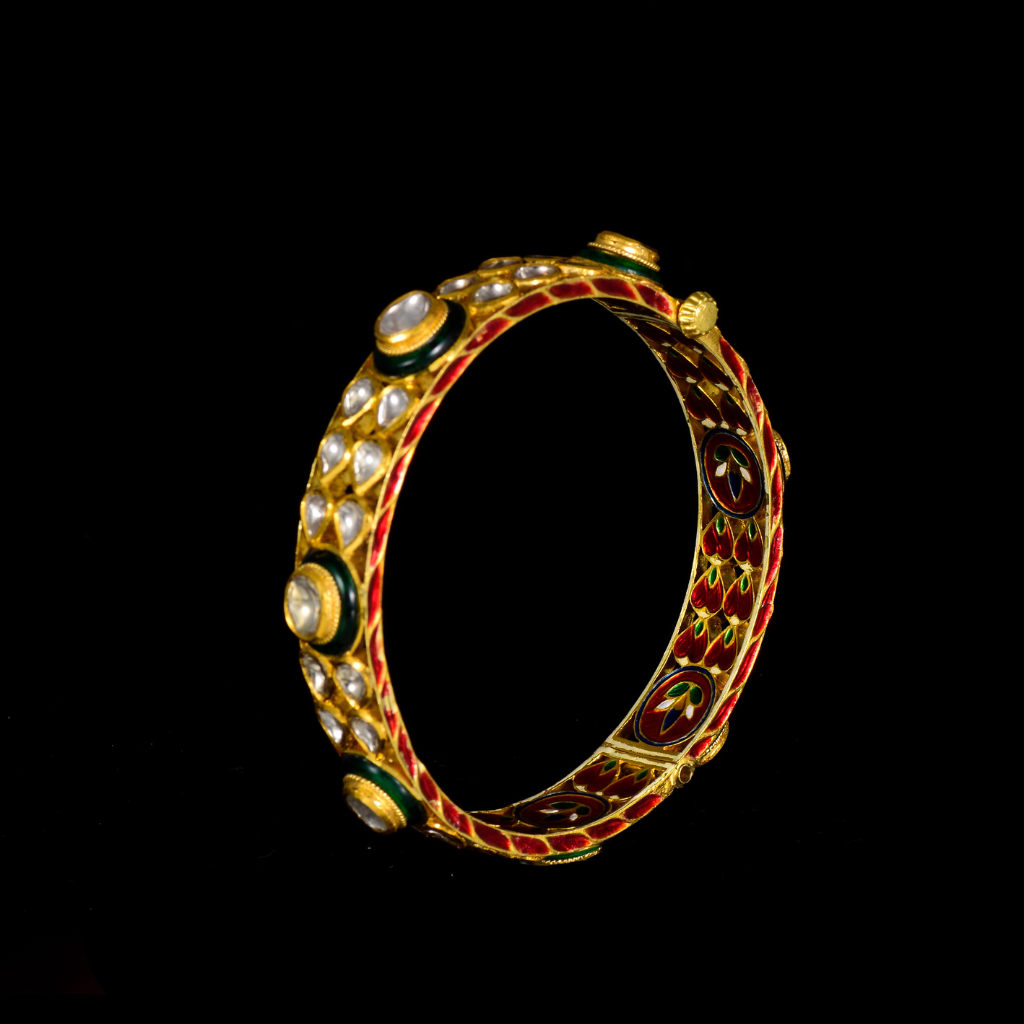 Kada pair with green churi meena in 18k gold and uncut diamond.Green Churi Meena Bangle is a beautiful and traditional piece of jewelry that adds a touch of elegance to any outfit. - KMB0538